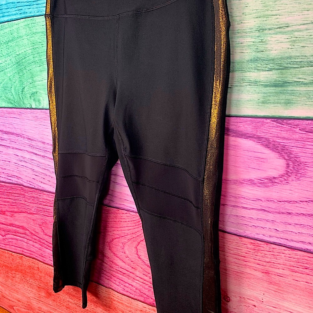 REEBOK black with gold stripes yoga Capri pants with Mesh like New